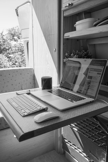 Clean, minimal desk with laptop in a camper